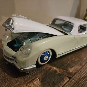 Classic White and Blue Toy Car